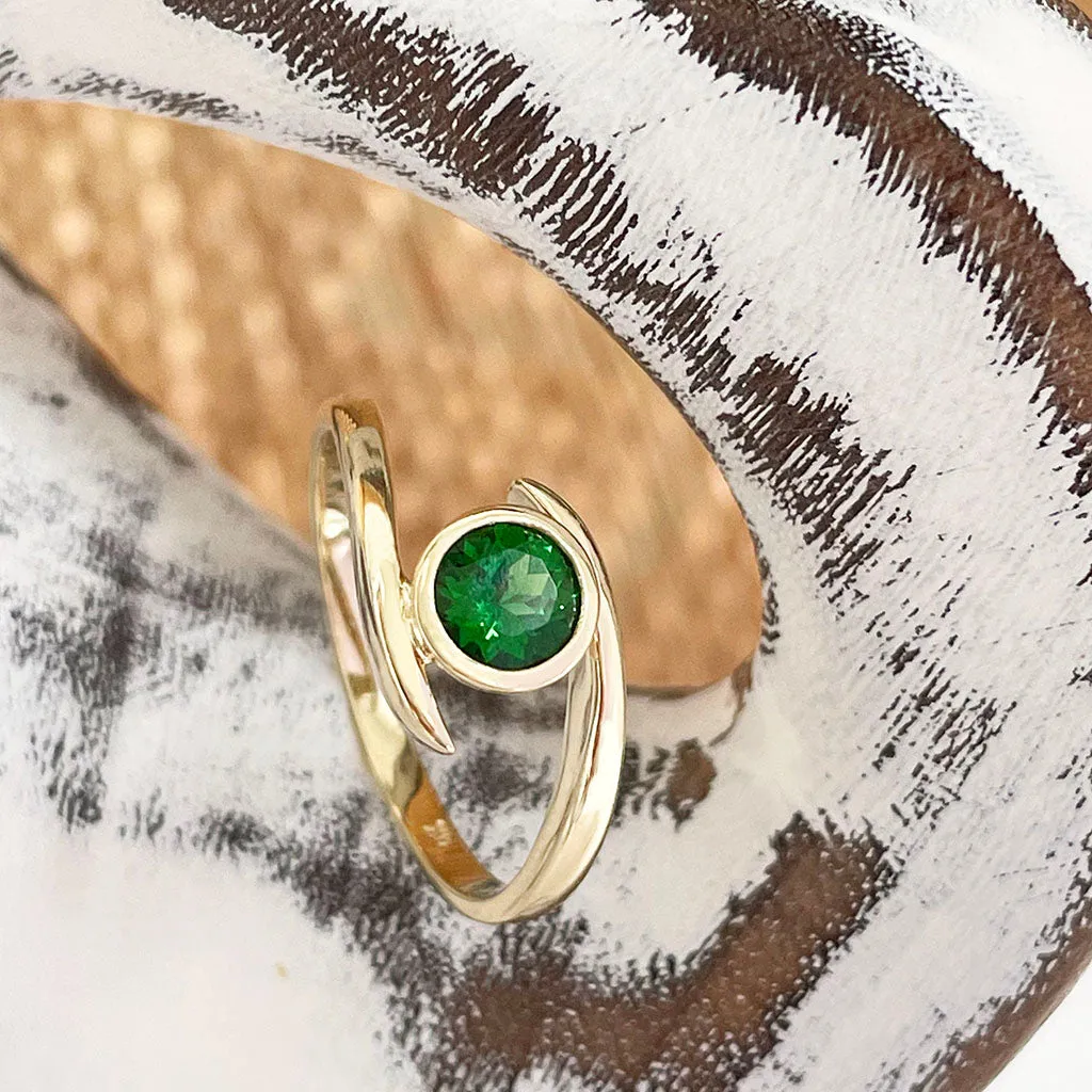 Flirty Twist and Turn Bezel Set Tsavorite Yellow Gold Ring