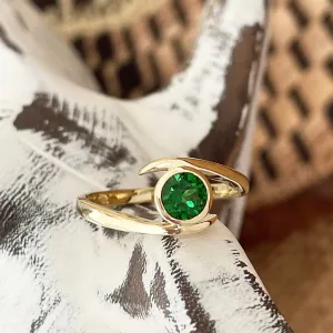 Flirty Twist and Turn Bezel Set Tsavorite Yellow Gold Ring