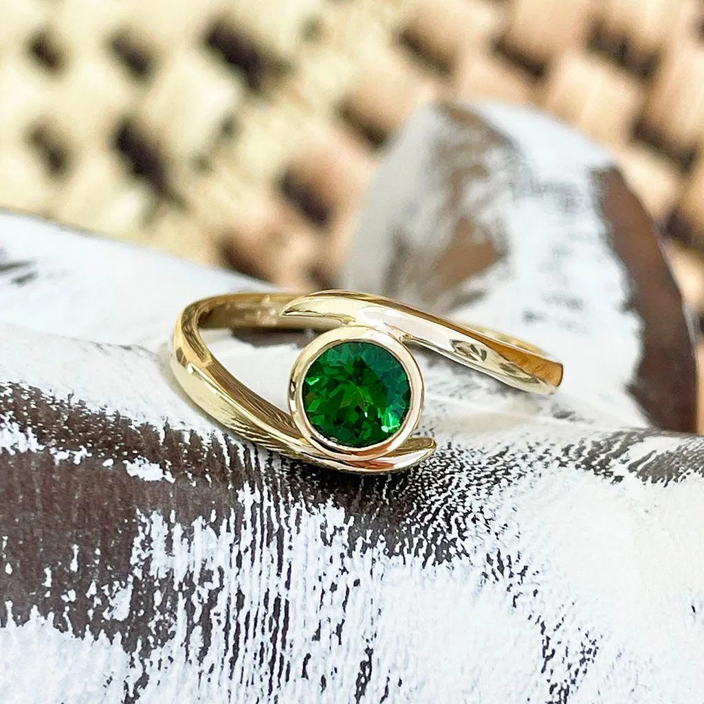 Flirty Twist and Turn Bezel Set Tsavorite Yellow Gold Ring